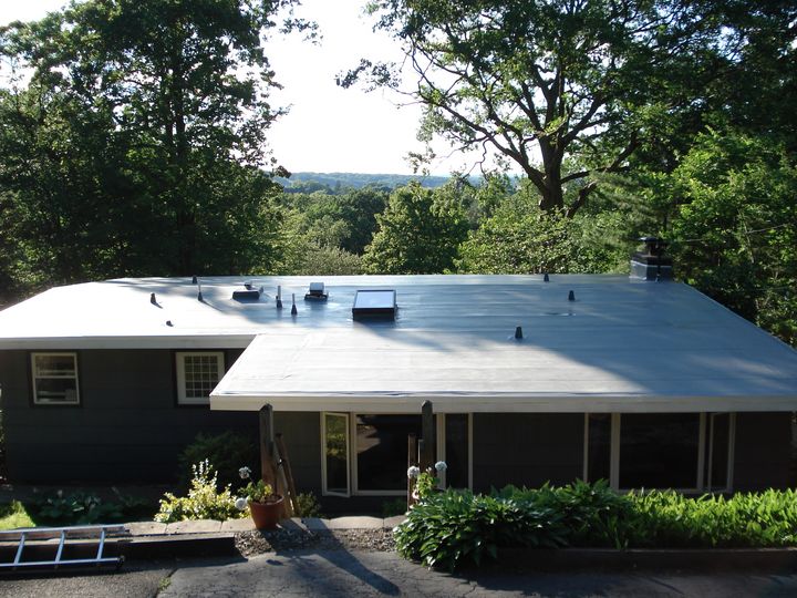 Completed flat roofing system on a residential home