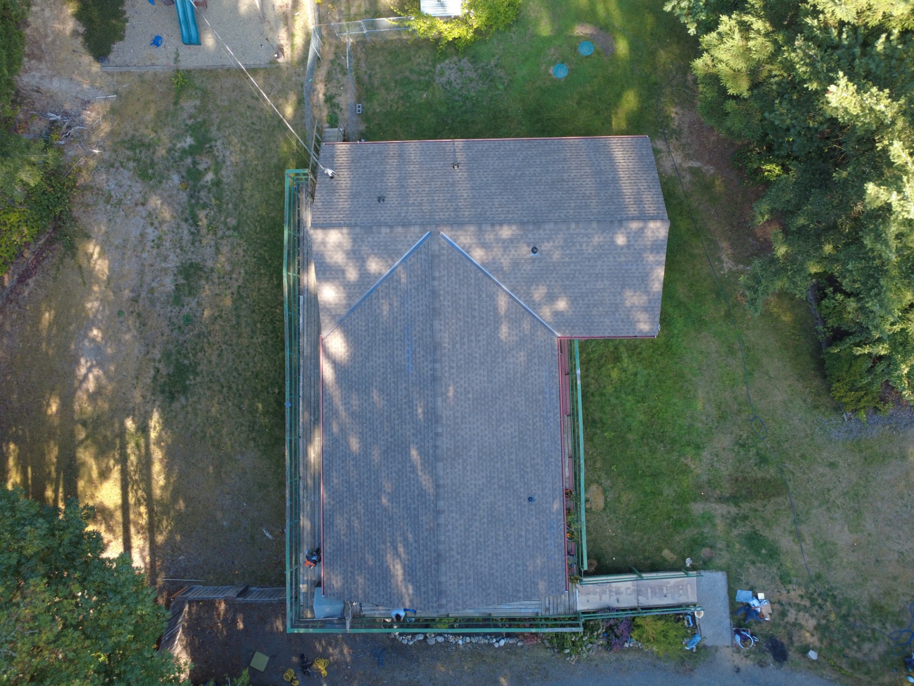Top-down aerial view of a completed roof and decking replacement in Silverdale, Washington