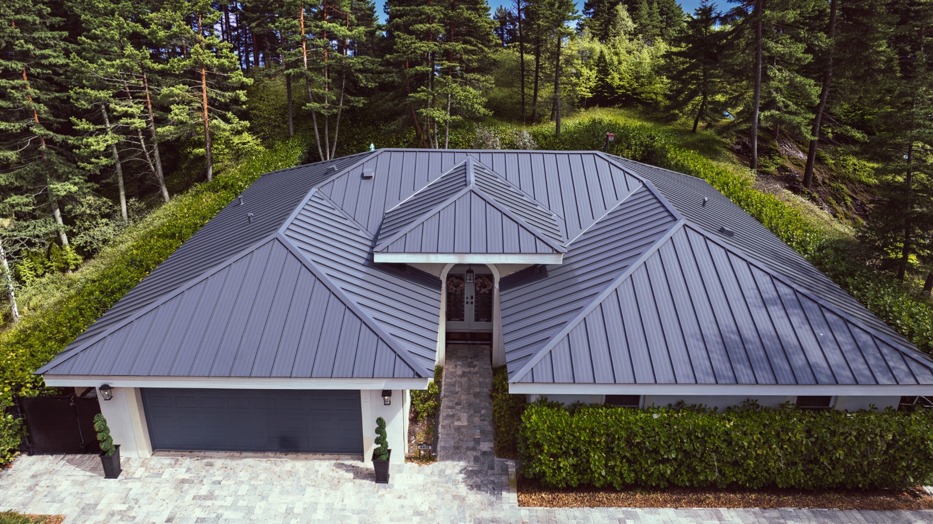 Completed standing-seam metal roof on a residential home