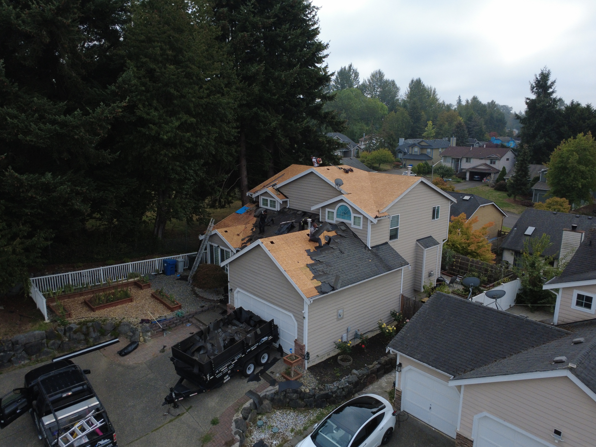 Aerial view of a roof replacement in progress in Western Washington